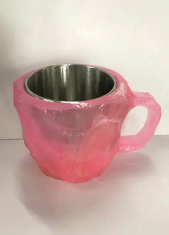 “Pink  resin mug showing mineral crystal pattern”